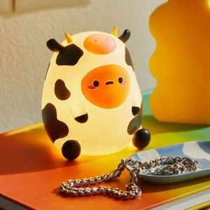 smoko Tato in cow costume glow light